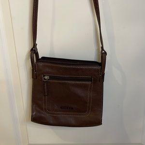Brown leather fossil bag.